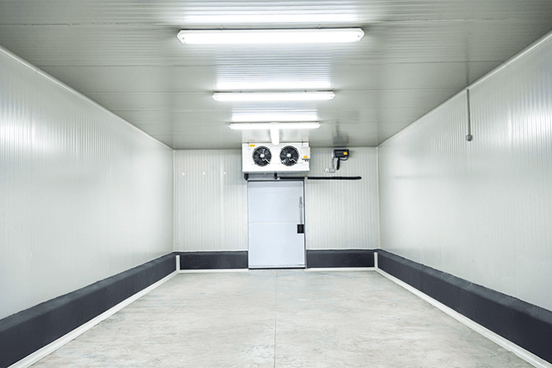 Cold Rooms Hero Commercial cold room with black bottom rim with 3 white lights